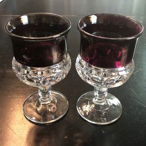 Pair of King’s Crown wine glasses with thumbprint stem in cranberry. 1950s